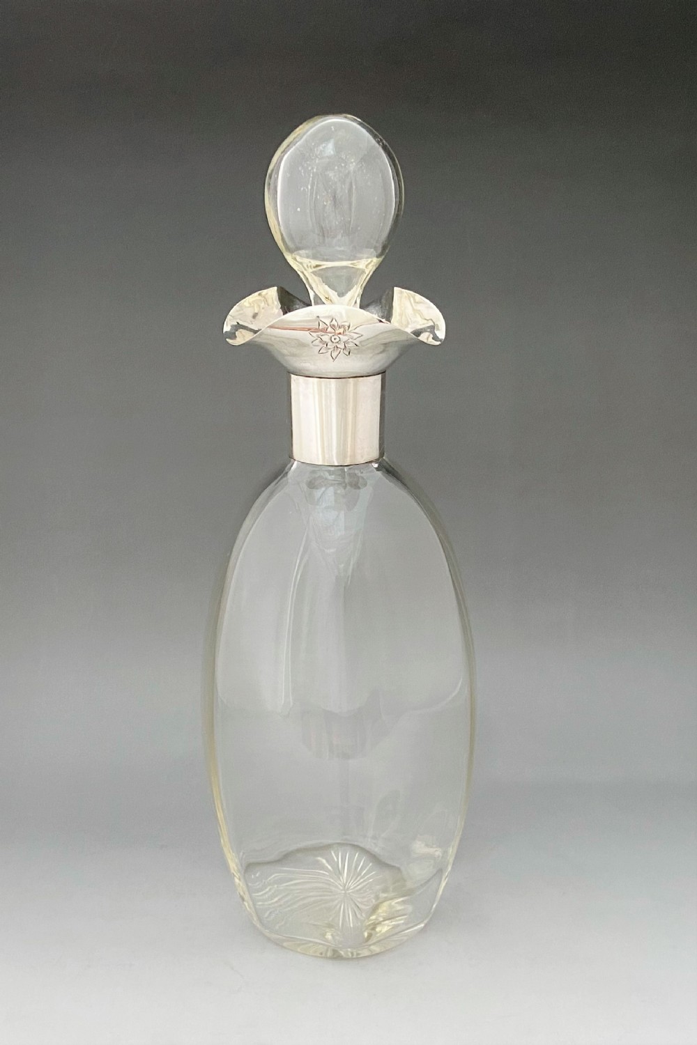 A lovely Edwardian silver mounted decanter