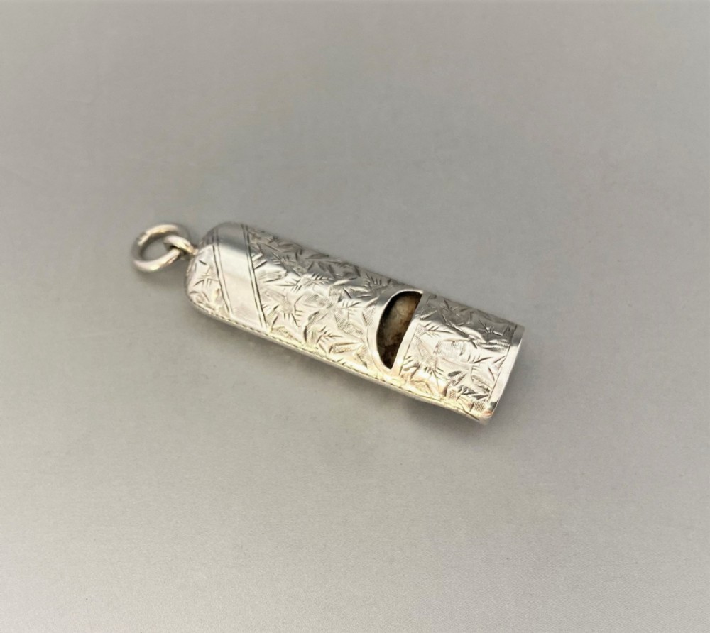 A delightful Victorian silver dog whistle