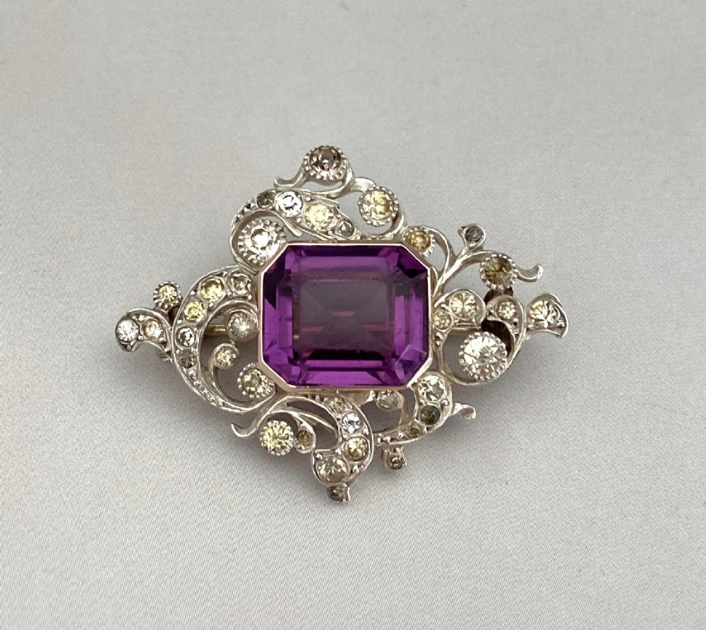 A stunning silver brooch set with gold mounted Amethyst