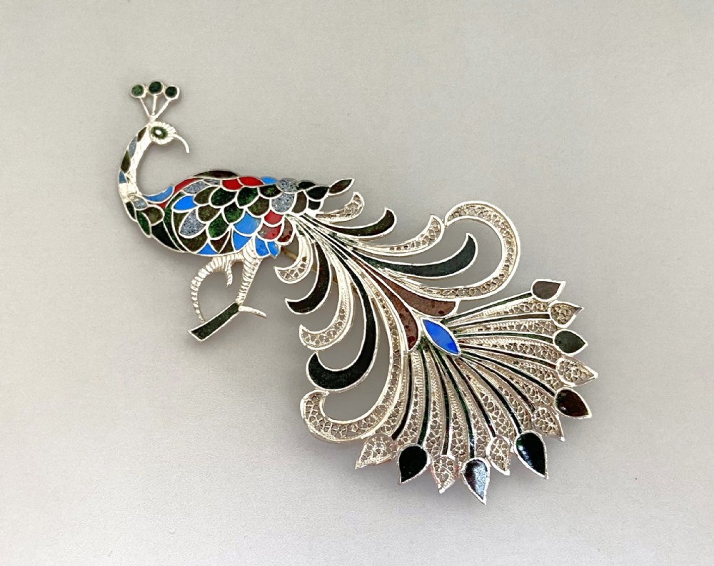 A gorgeous silver filigree & enamel Peacock brooch 