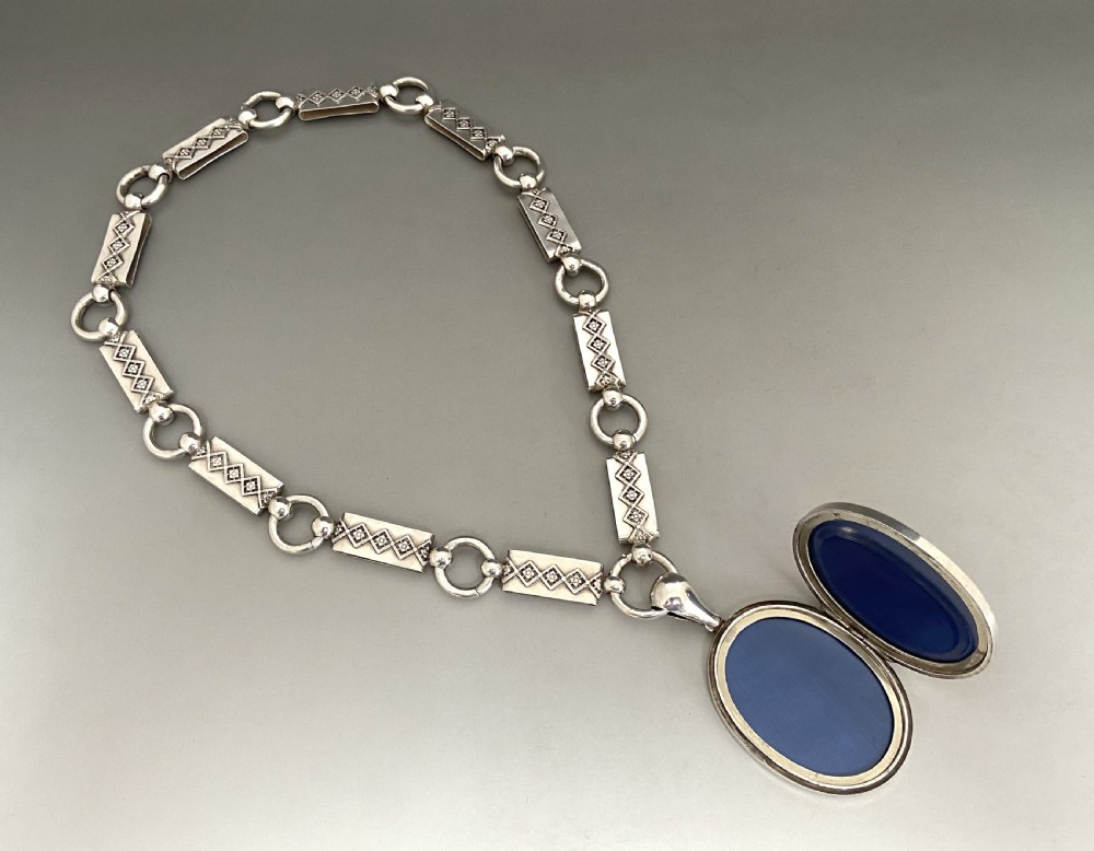 An unusual late Victorian silver neck chain & locket View VI