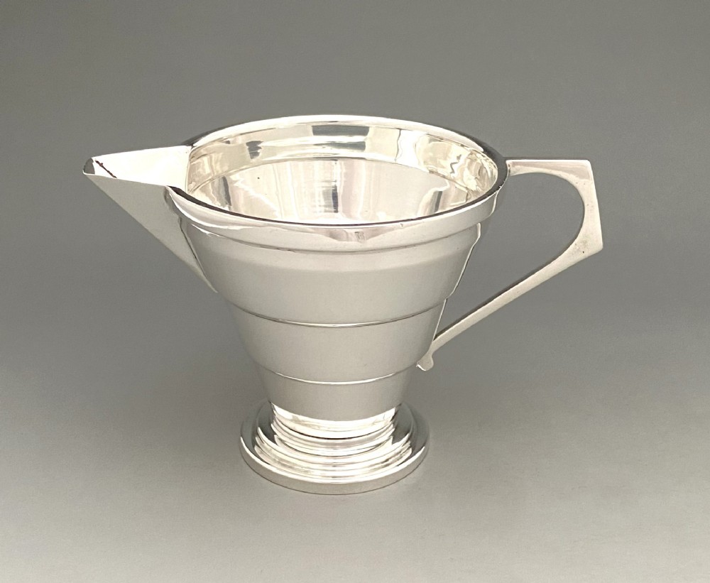 A stylish Art Deco silver cream jug