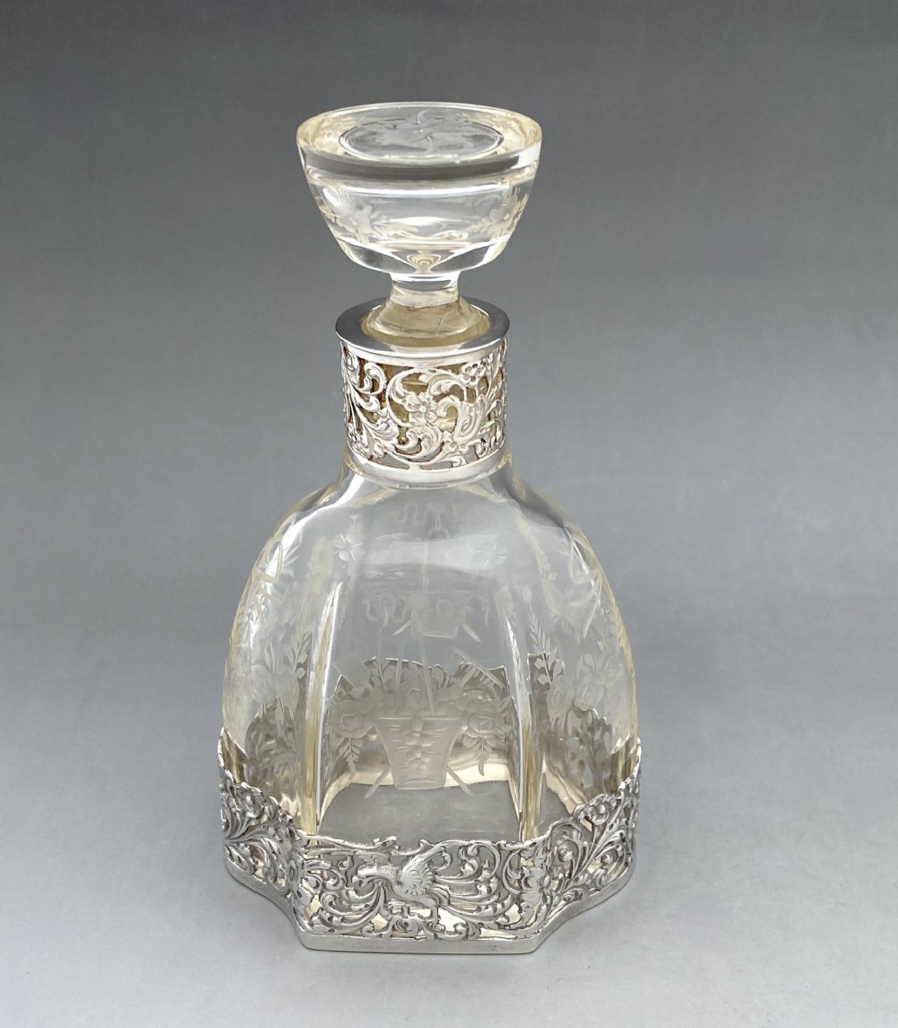 An exquisite Dutch silver mounted perfume/ cologne bottle 