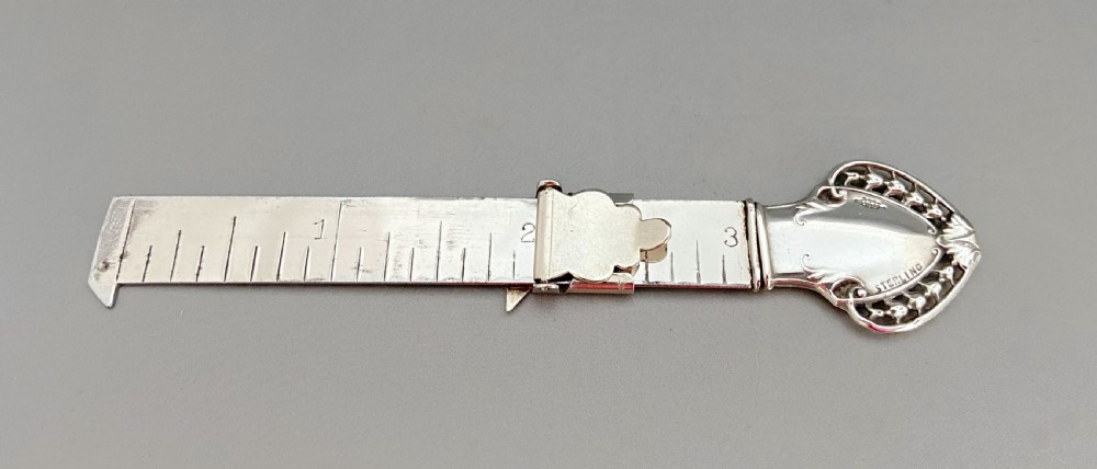 A rare silver mounted hem ruler/ caliper
