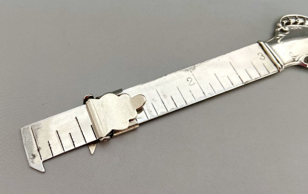 A rare silver mounted hem ruler/ caliper View IV