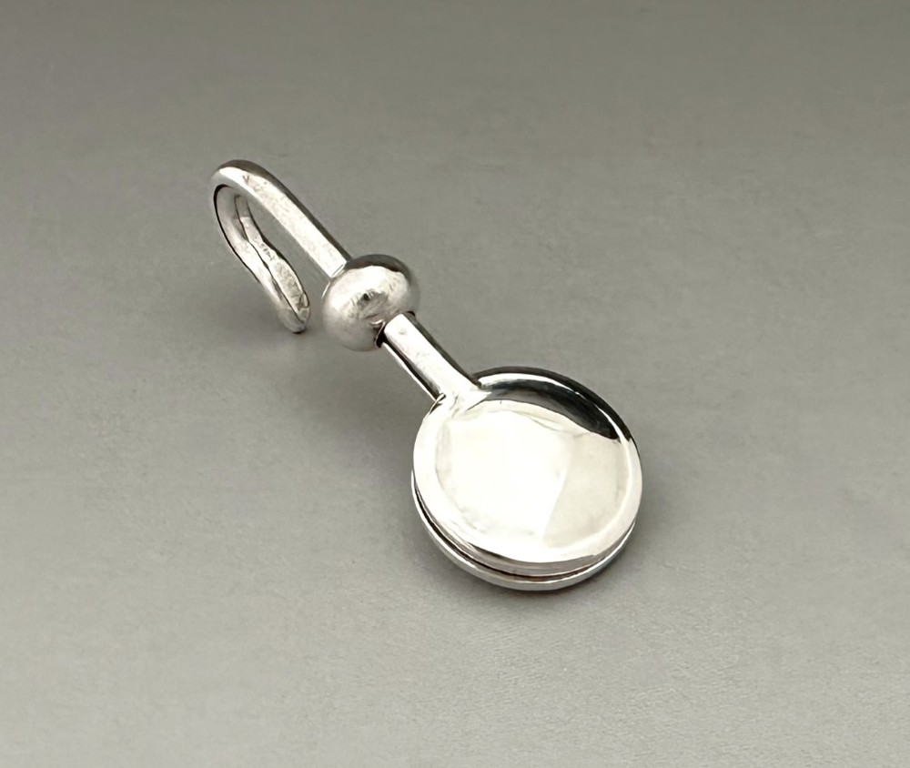 A fine George V silver napkin clip