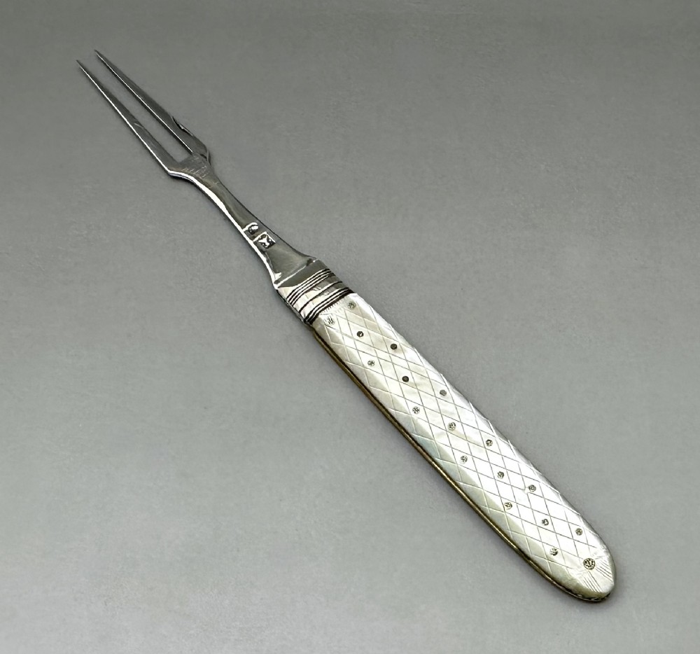 A late 18th Century silver folding fruit fork
