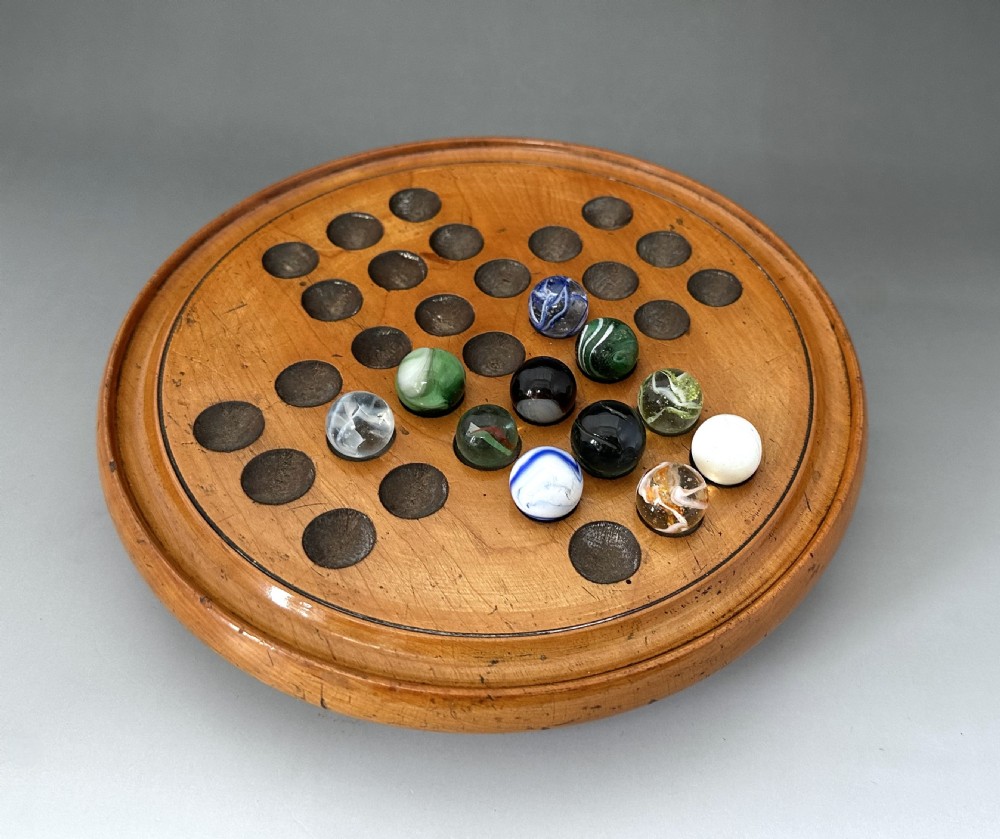 An attractive Victorian Solitaire board & glass marbles View IV