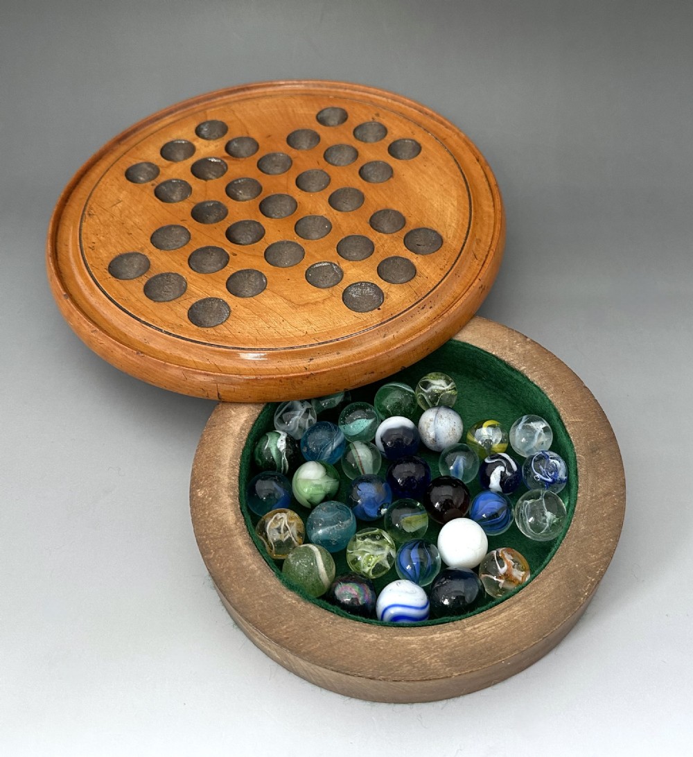An attractive Victorian Solitaire board & glass marbles View VI