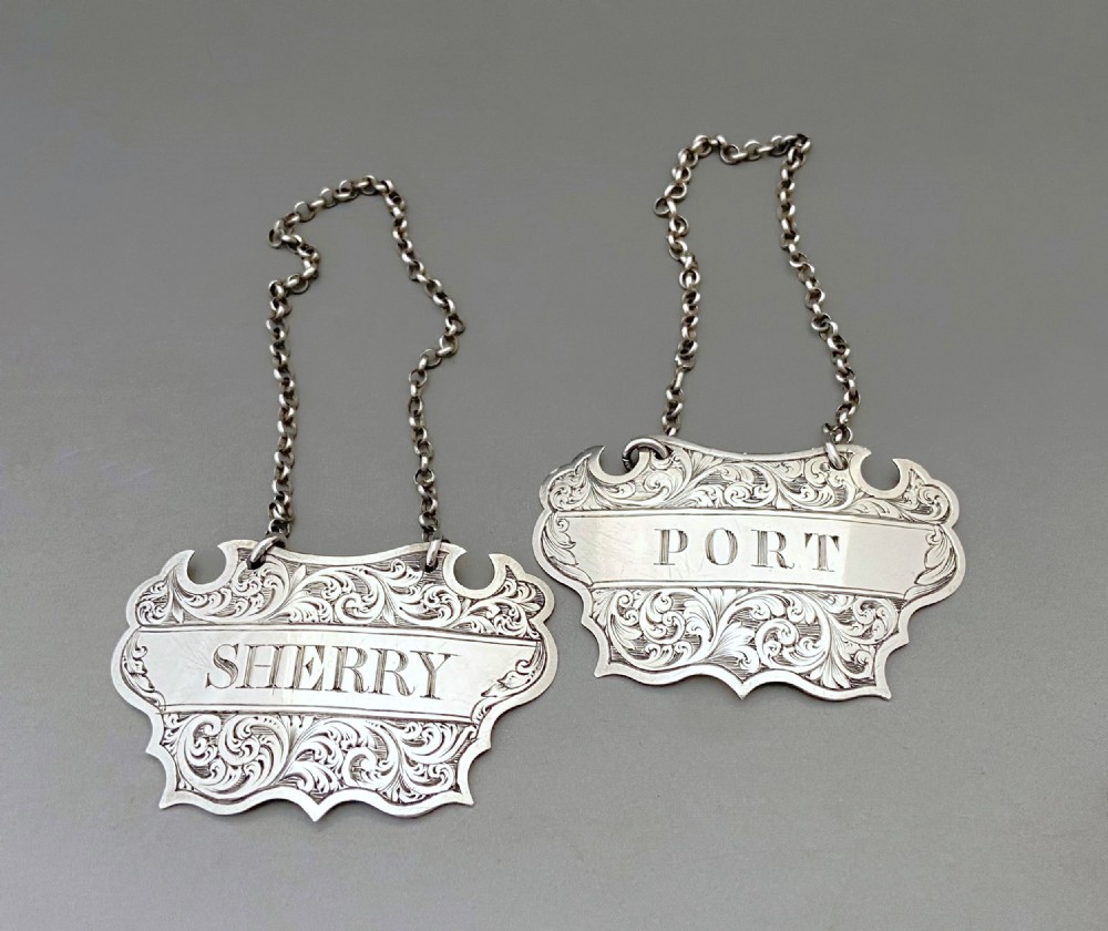 An attractive pair of Scottish silver decanter labels