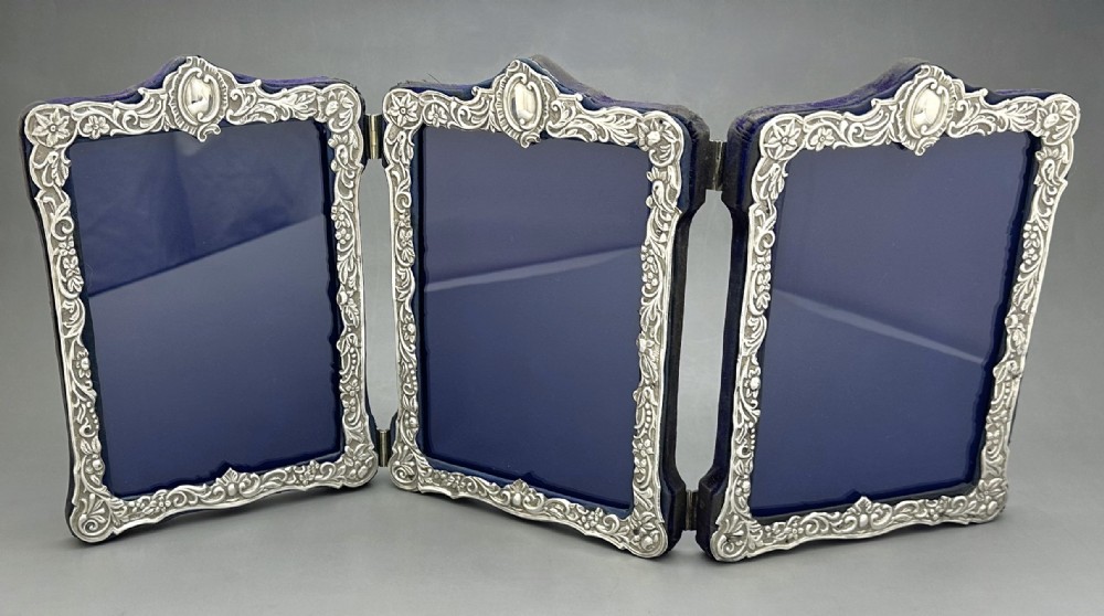A superb Victorian silver triple photo frame