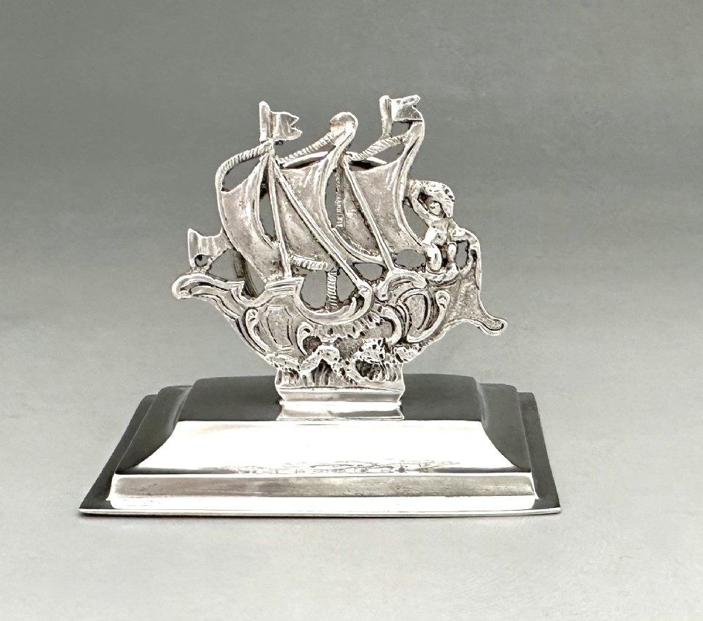 A superb cast silver Galleon menu holder 