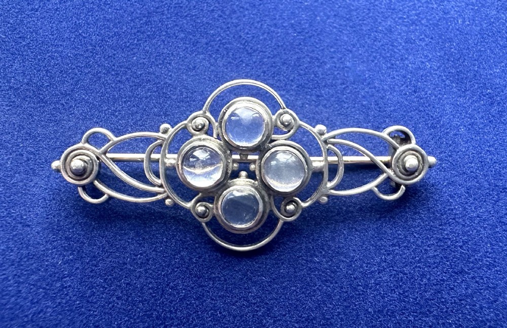 A gorgeous early 20th Century silver & moonstone brooch