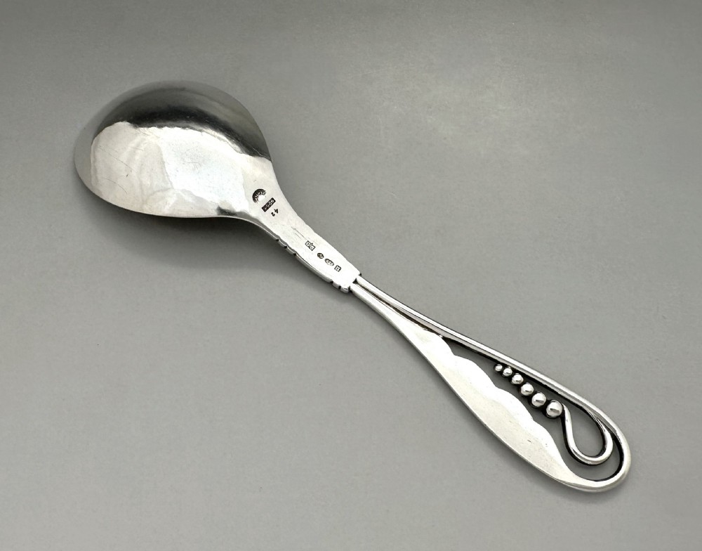A stylish George Jensen silver preserve spoon View IV