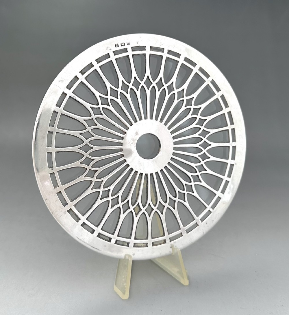 A stylish silver mounted teapot stand/coaster