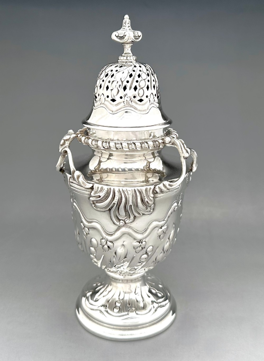 A superb silver sugar sifter/ caster by the great William Comyns