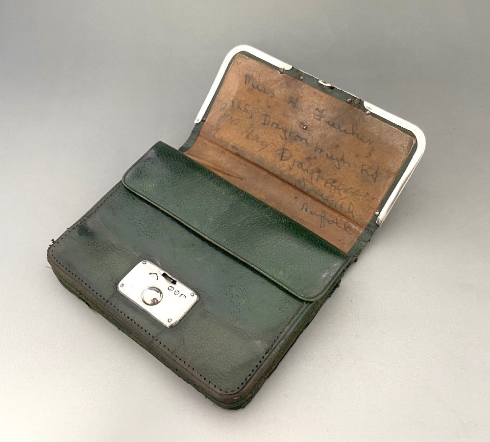 A dark green leather purse featuring intricate silver Art Nouveau corner mounts and a central silver clasp. View VI