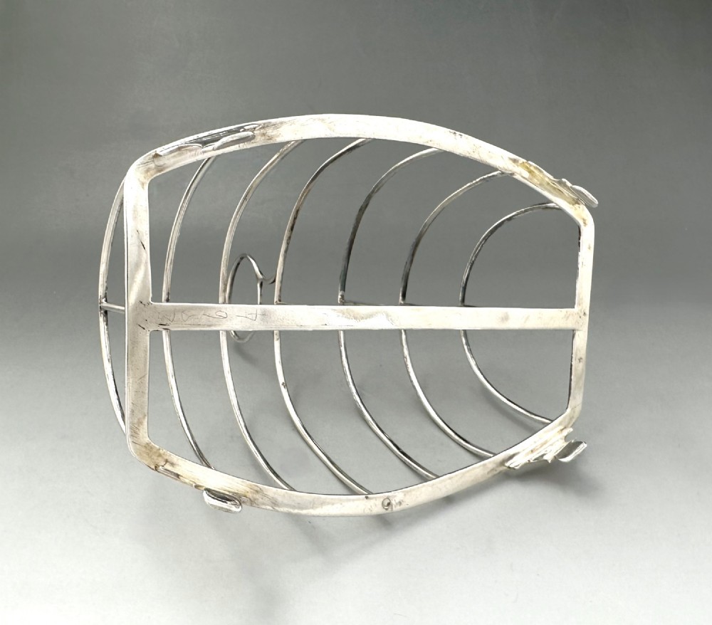 A handsome George III silver toast rack View IV