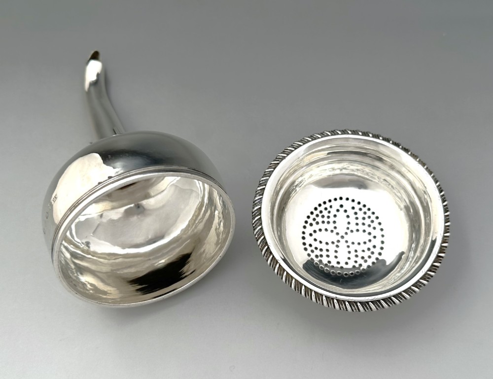 A superb George III silver wine funnel & strainer View VII