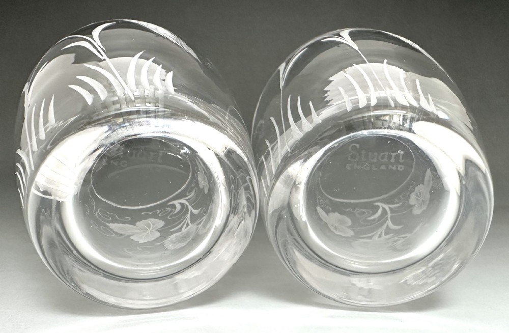 A pair of clear glass tumblers decorated with wheel-engraved botanical motifs depicting hops and barley. View VII