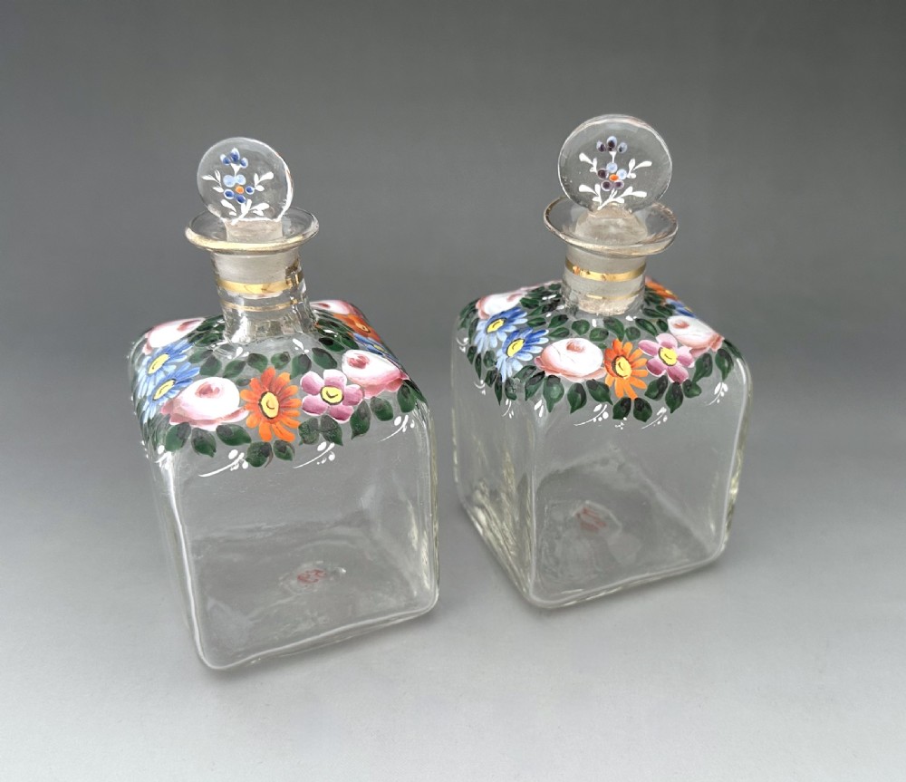 A gorgeous pair of perfume/ cologne bottles with enamelled decoration