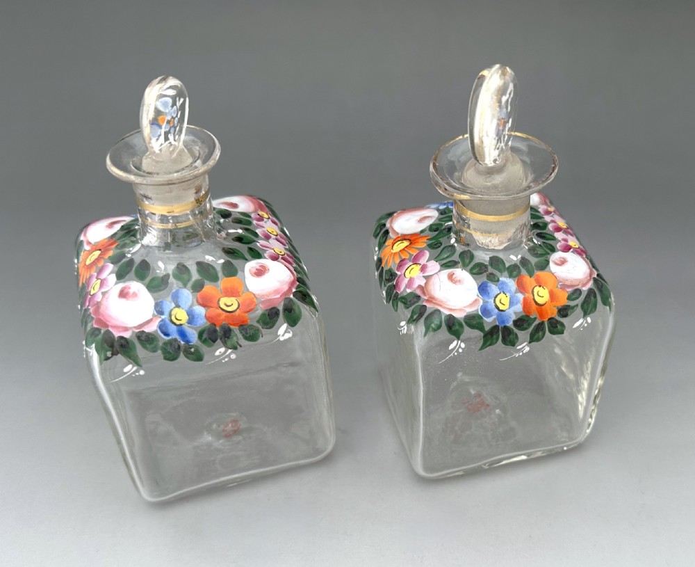 A gorgeous pair of perfume/ cologne bottles with enamelled decoration View V