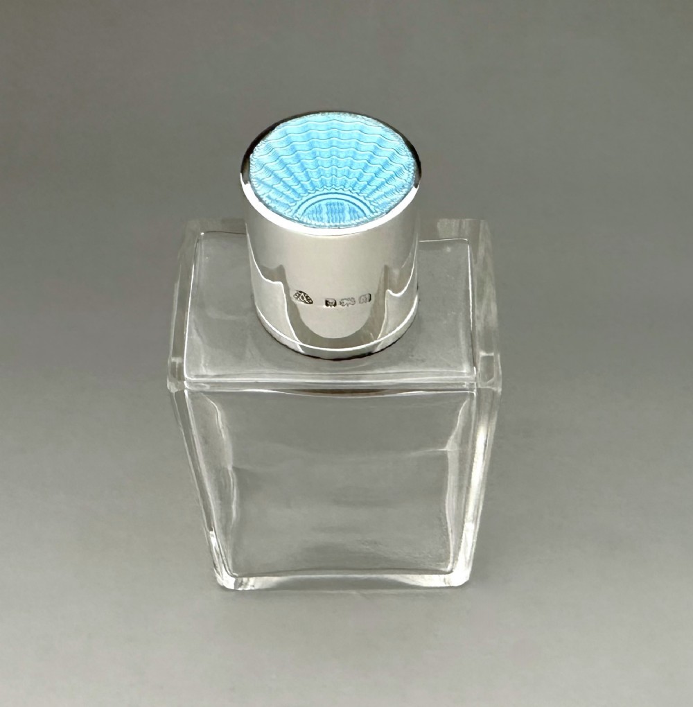 An Art Deco Silver & Guilloche Enamel Cologne Bottle