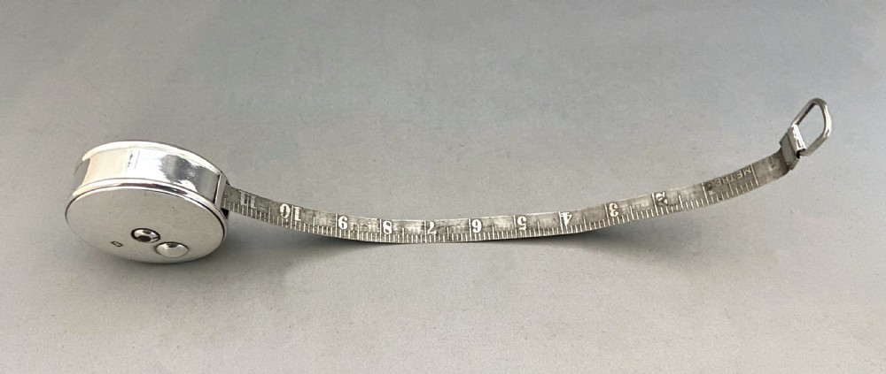 A superb Victorian silver cased tape measure View VI