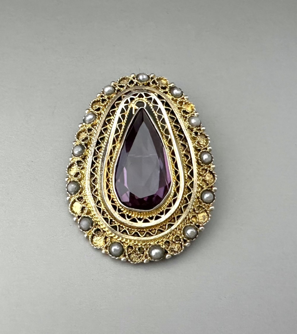 A gorgeous mid century silver gilt filigree brooch