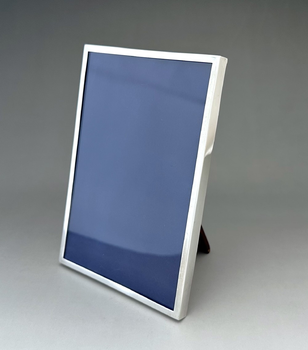 A charming George V portrait silver photo frame