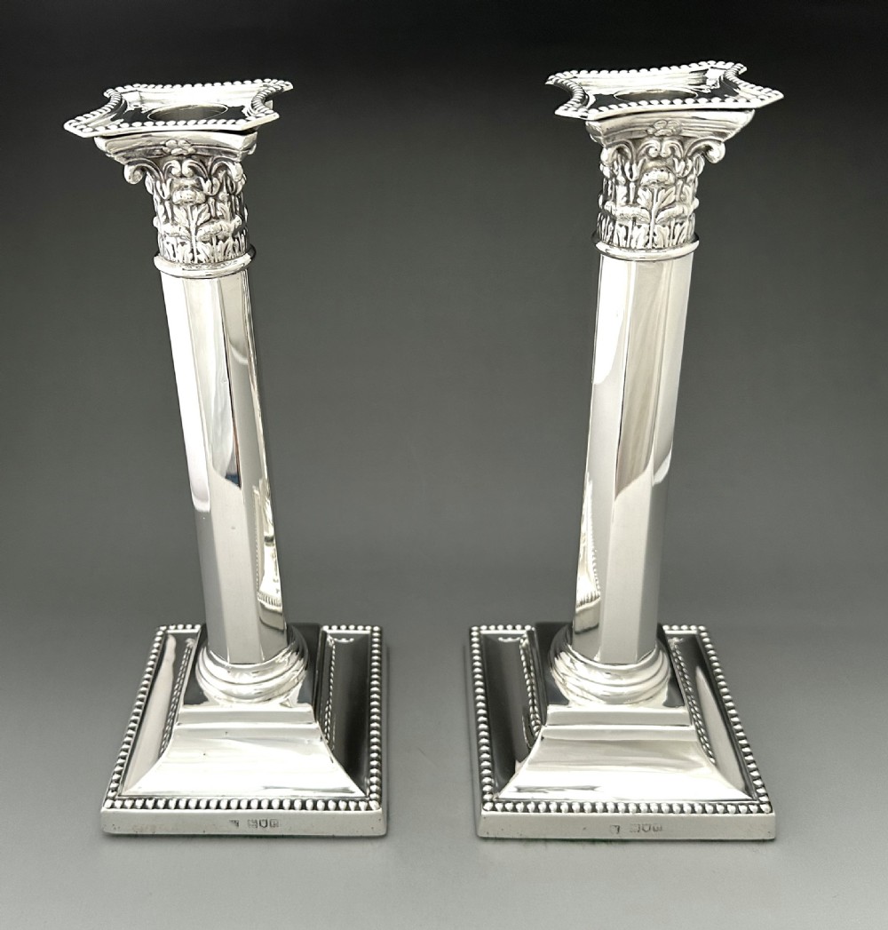 A superb pair of Victorian full height Corinthian column candlesticks  View III