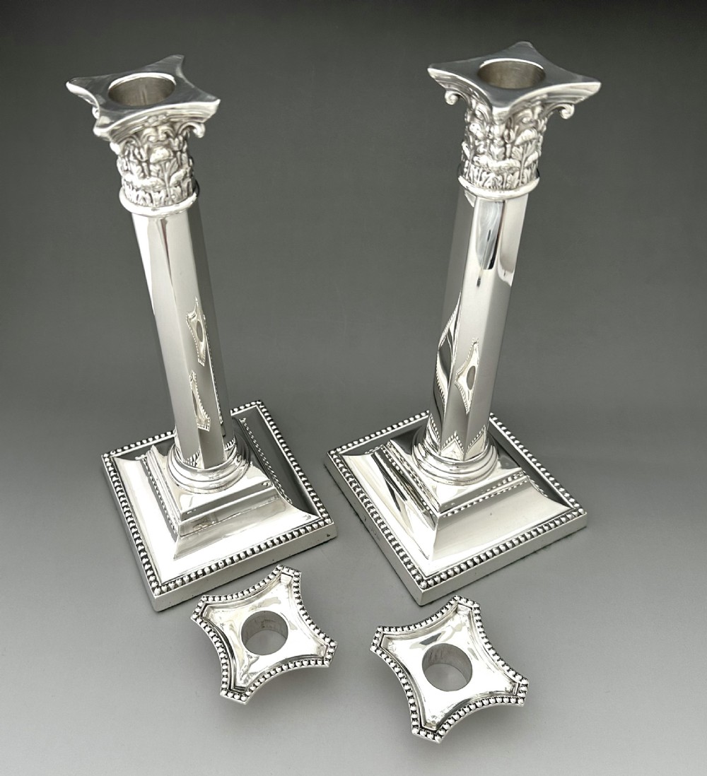 A superb pair of Victorian full height Corinthian column candlesticks  View VIII