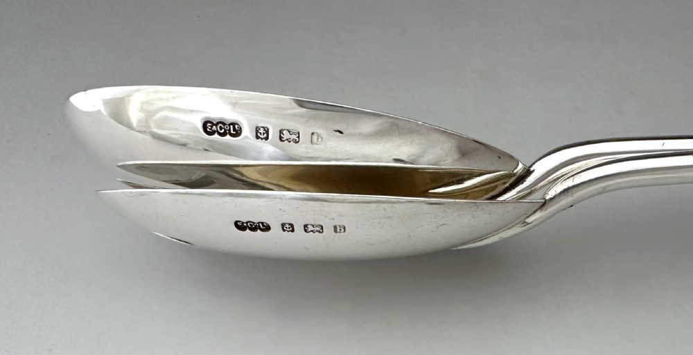 A pair of Edwardian silver salad servers featuring a rounded spoon and a three-pronged fork with decorative fluted ferrules and clear glass drop handles. View VIII