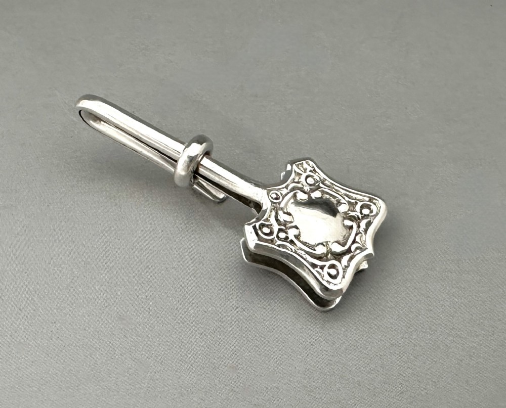 A useful George VI silver napkin clip