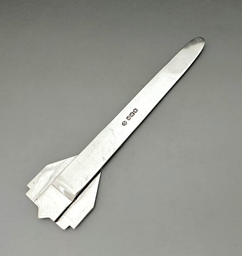 An Art Deco silver novelty advertising bookmark featuring an embossed crest and an engraved flat stem detailing historic English hotels. View V