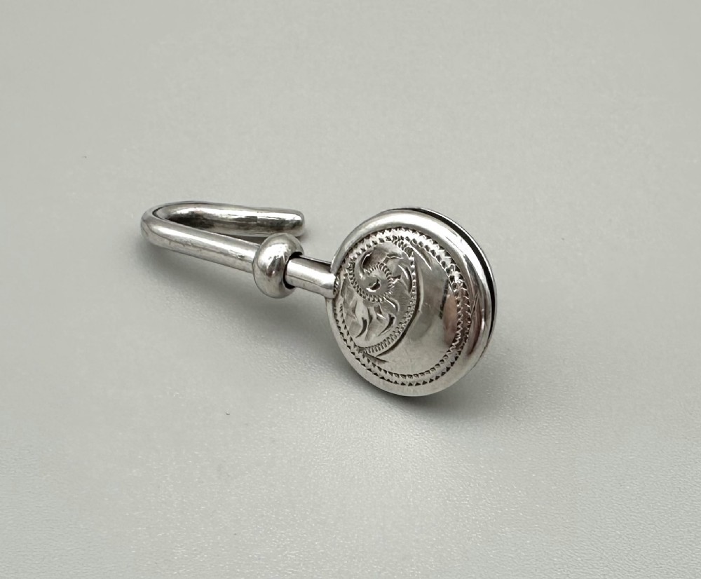 A fine George V silver napkin clip