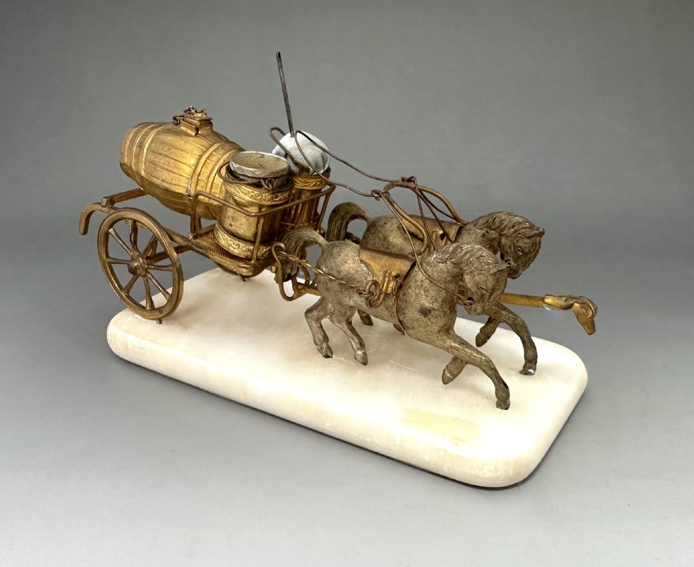 A French Palais Royal gilt metal horse-drawn carriage sewing companion mounted on a white alabaster base. View II