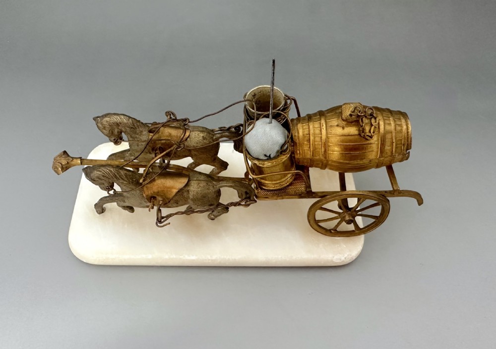 A French Palais Royal gilt metal horse-drawn carriage sewing companion mounted on a white alabaster base. View III