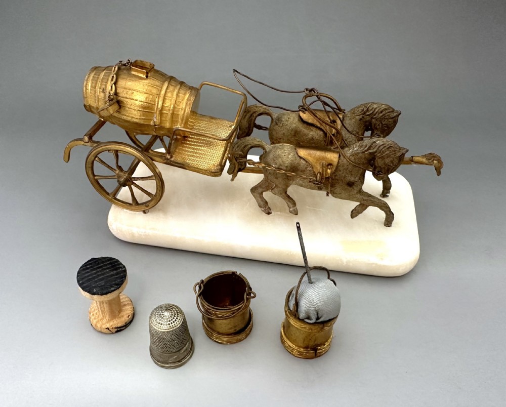 A French Palais Royal gilt metal horse-drawn carriage sewing companion mounted on a white alabaster base. View IV