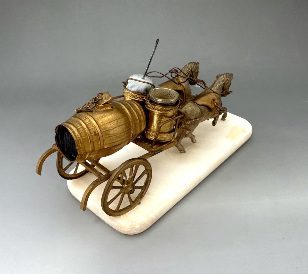 A French Palais Royal gilt metal horse-drawn carriage sewing companion mounted on a white alabaster base. View V