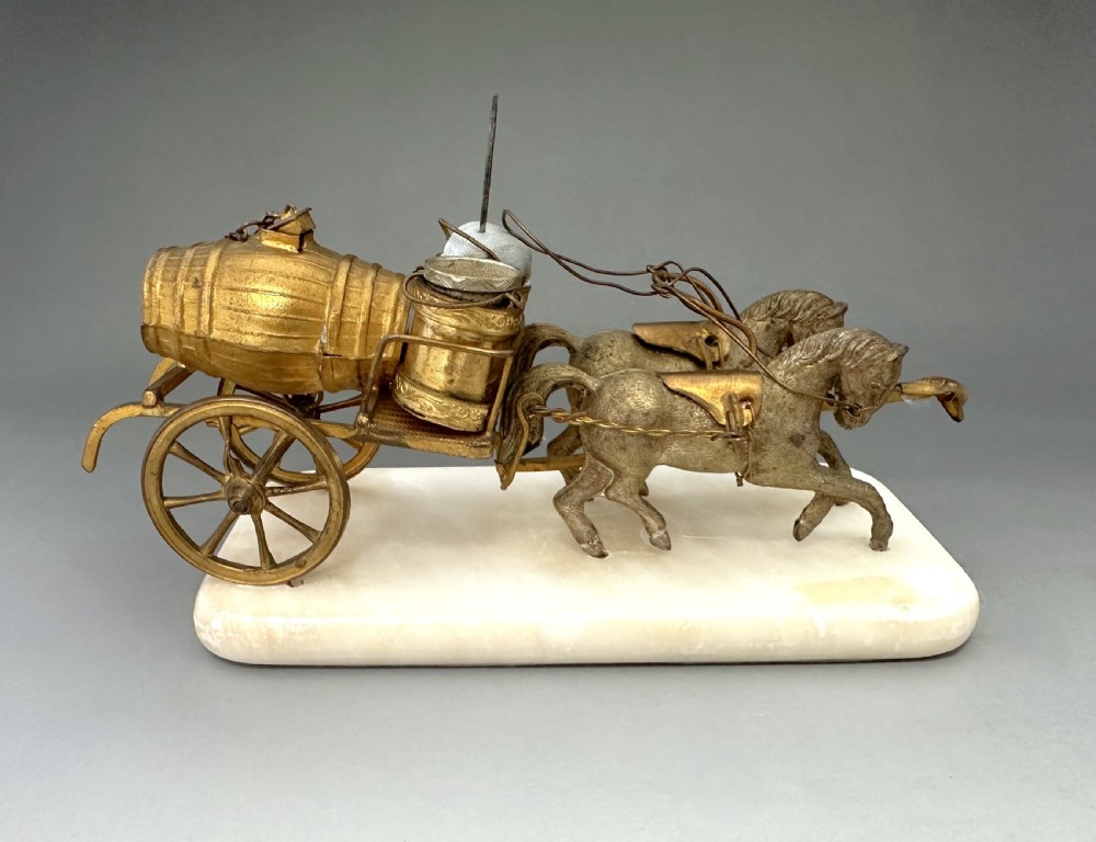 A French Palais Royal gilt metal horse-drawn carriage sewing companion mounted on a white alabaster base. View VI