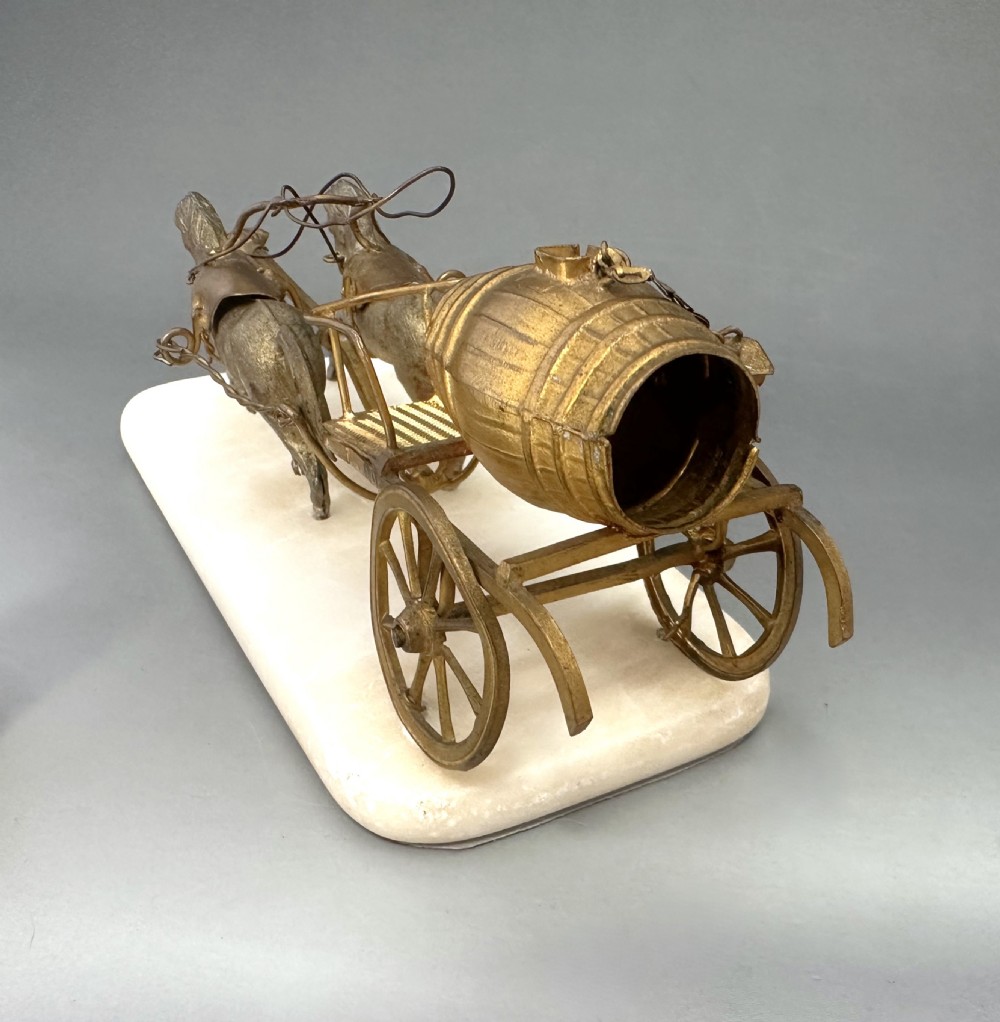 A French Palais Royal gilt metal horse-drawn carriage sewing companion mounted on a white alabaster base. View VII