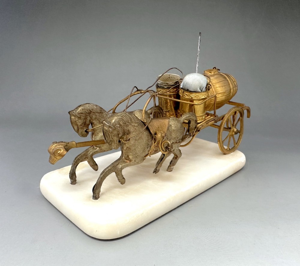 A French Palais Royal gilt metal horse-drawn carriage sewing companion mounted on a white alabaster base. View VIII