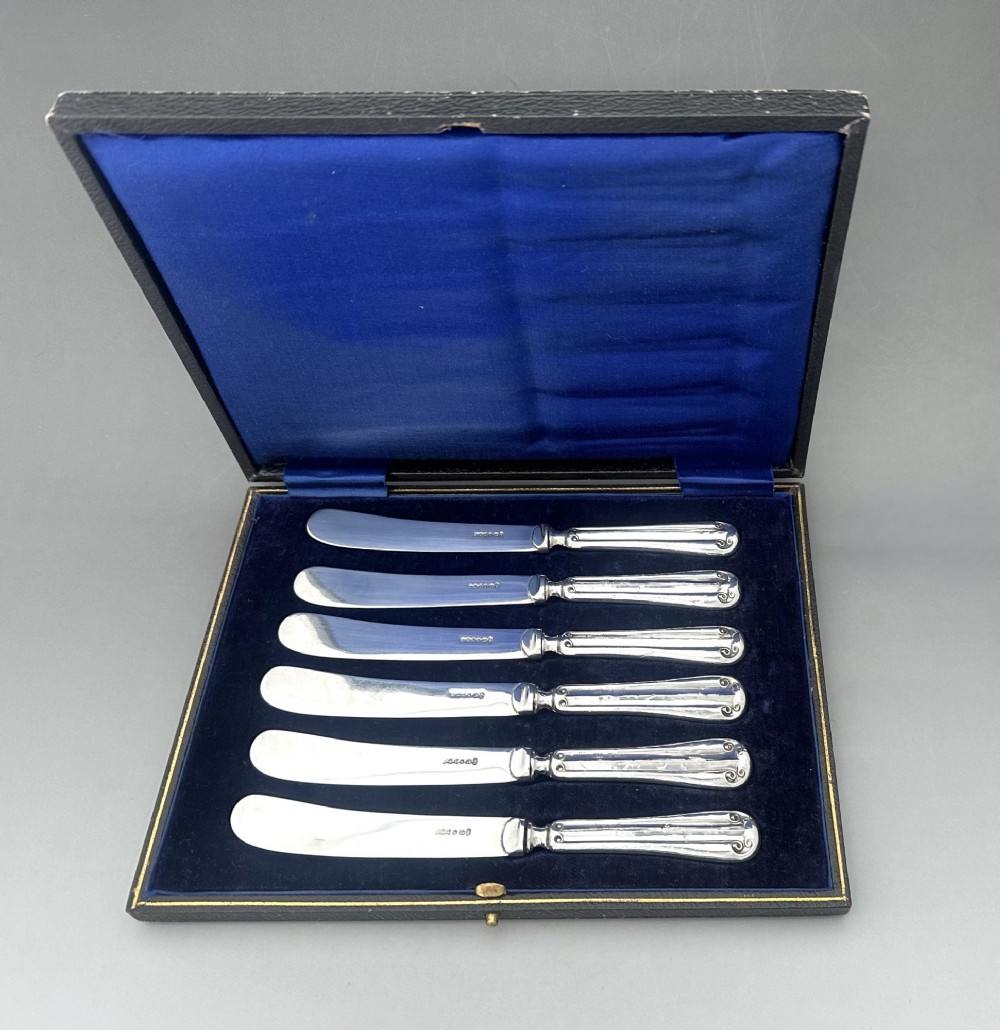 A useful set of 6 boxed silver handled butter knives View III