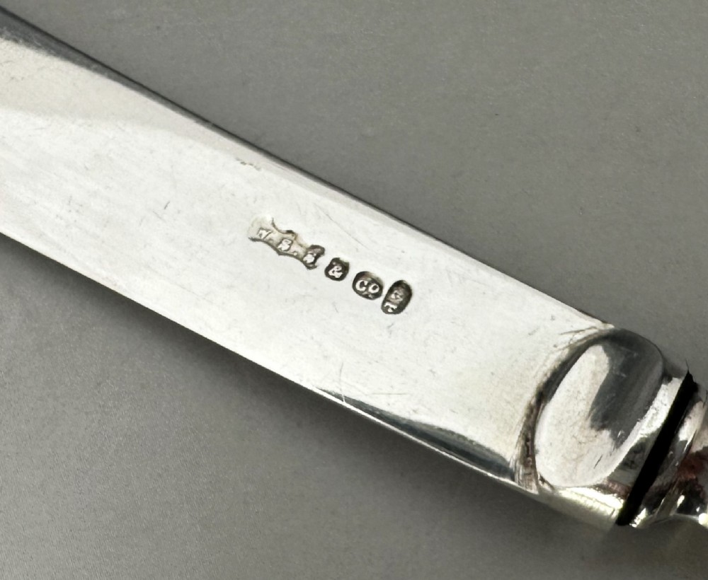 A useful set of 6 boxed silver handled butter knives View VII