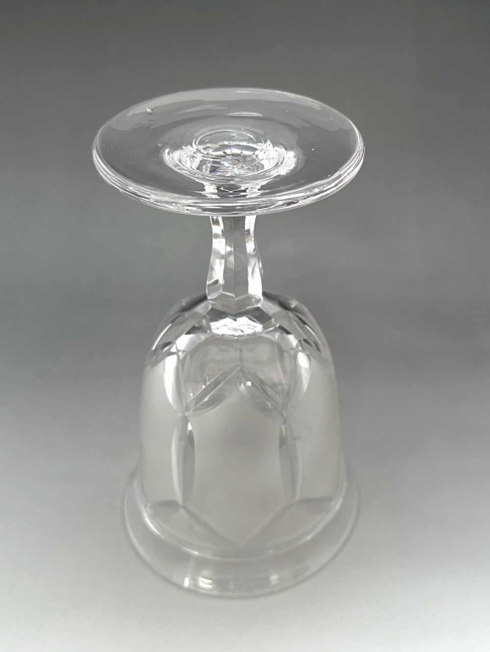 A set of six clear Victorian glass goblets, each featuring distinct hand-etched and cut geometric and floral patterns. View XIII