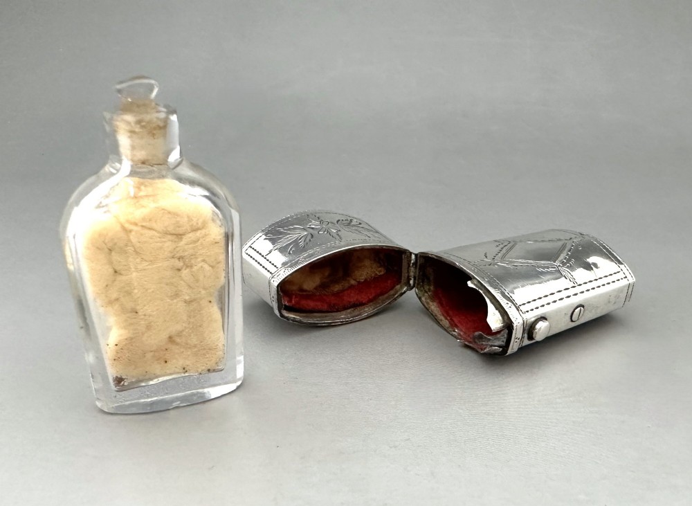 An antique Georgian sterling silver scent bottle case decorated with hand-engraved leaf and diamond motifs. View VII
