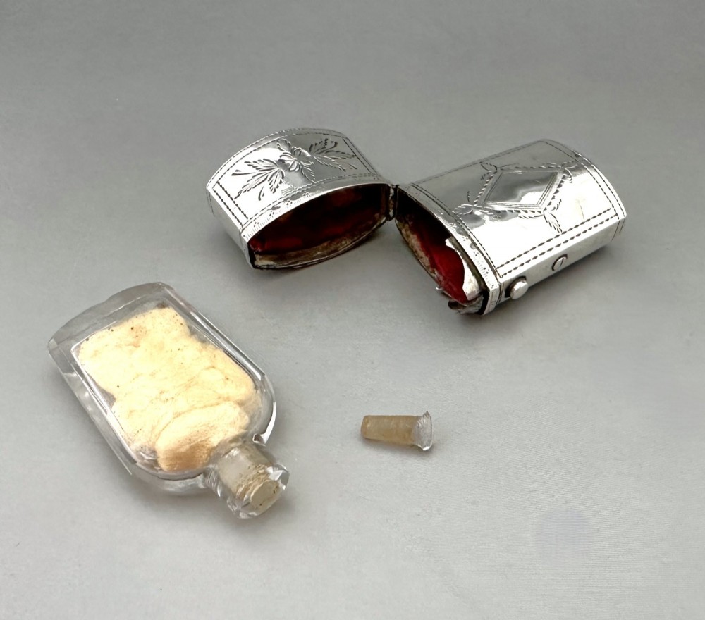 An antique Georgian sterling silver scent bottle case decorated with hand-engraved leaf and diamond motifs. View VIII