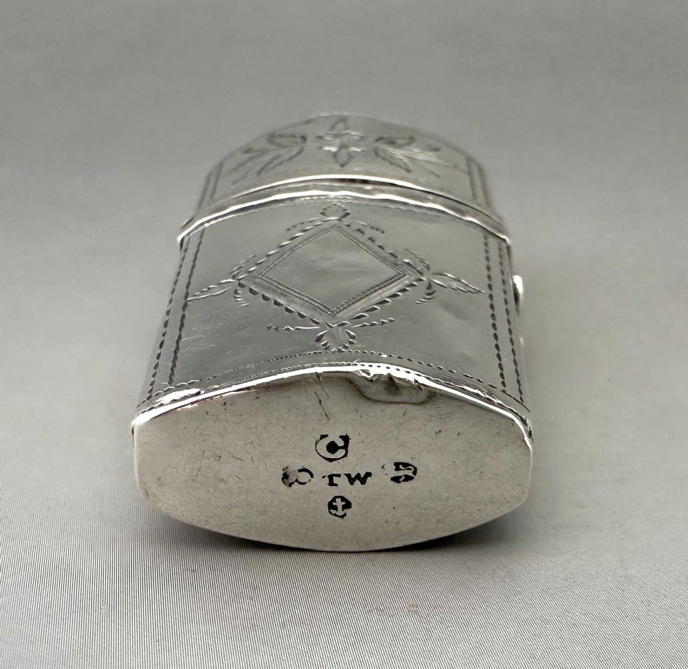 An antique Georgian sterling silver scent bottle case decorated with hand-engraved leaf and diamond motifs. View X