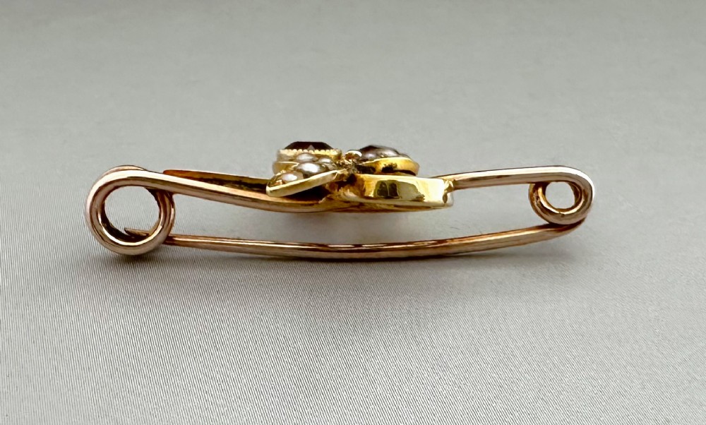 Victorian 9ct gold bar brooch featuring a central cherry motif with seed pearl leaves and two faceted pink gemstones. View III